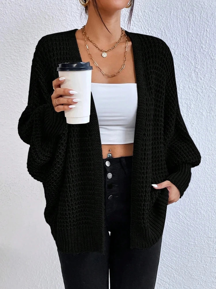 Fashionable and elegant solid color knitted sweater V-neck mid length hollowed out cardigan sweater women's top