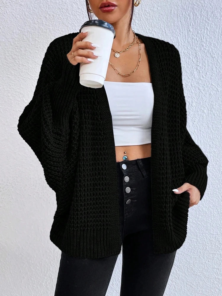Fashionable and elegant solid color knitted sweater V-neck mid length hollowed out cardigan sweater women's top