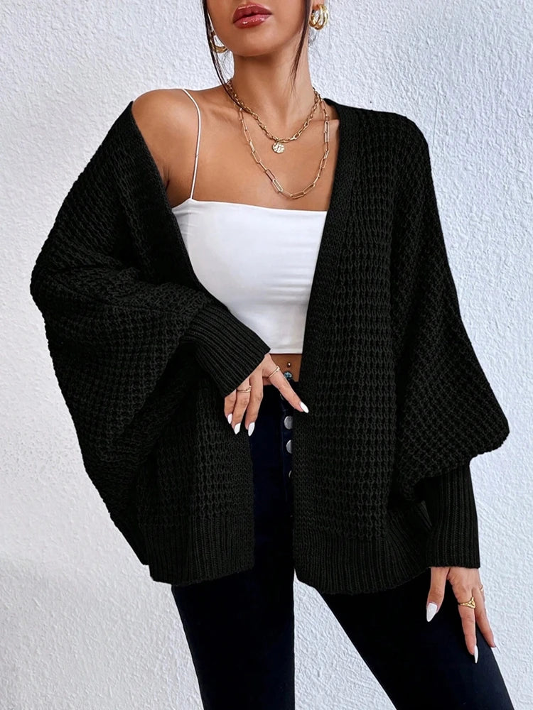 Fashionable and elegant solid color knitted sweater V-neck mid length hollowed out cardigan sweater women's top